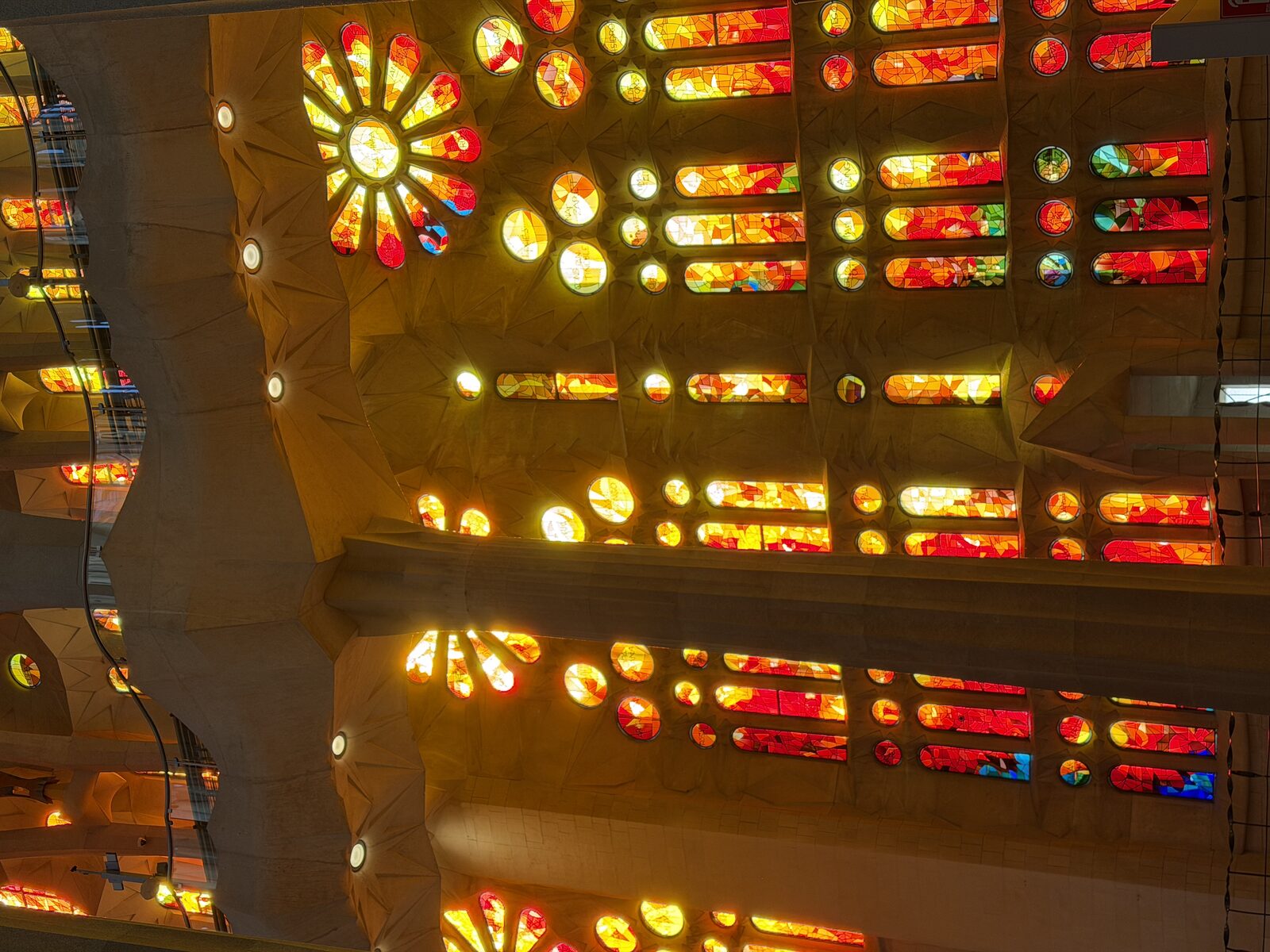 Stained glass interior of the Sagrada Familia in Barcelona.